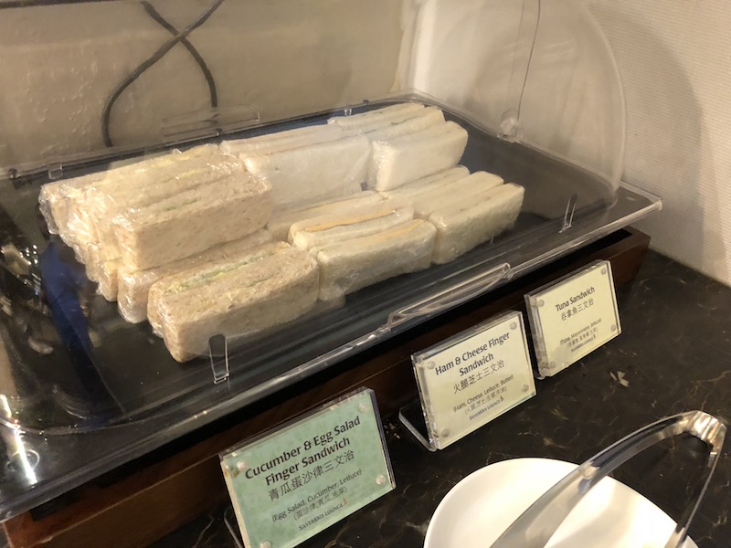 Finger sandwiches wrapped in plastic