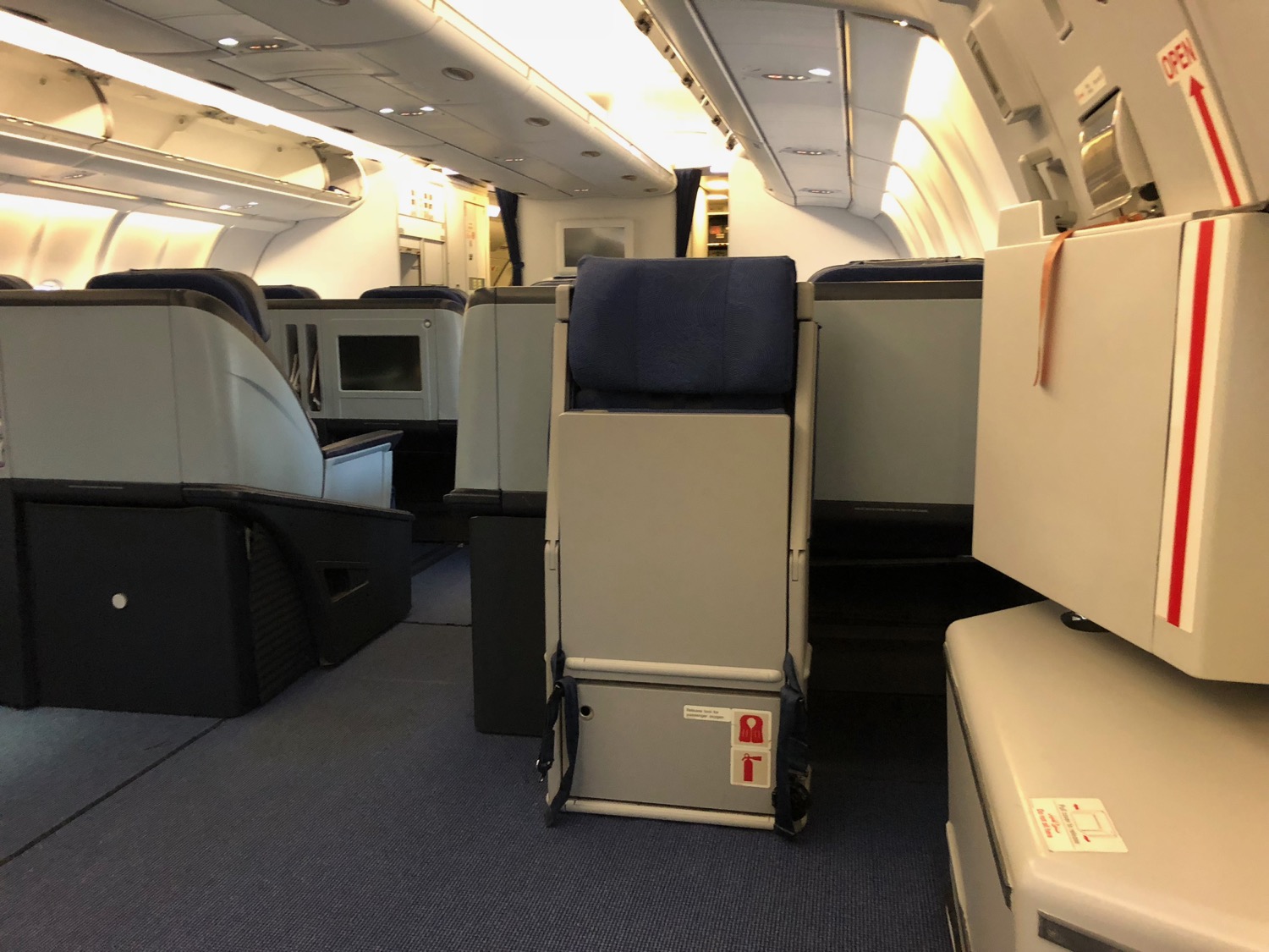 an airplane with seats and a few boxes