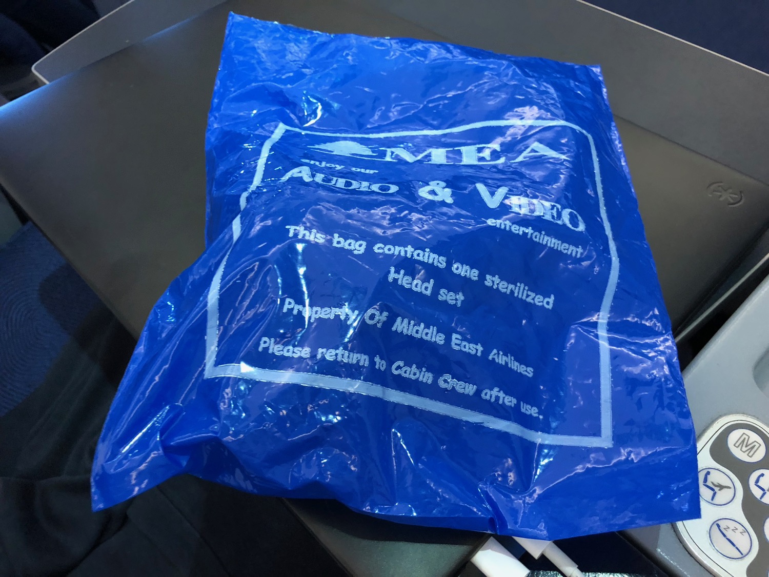 a blue plastic bag with white text on it