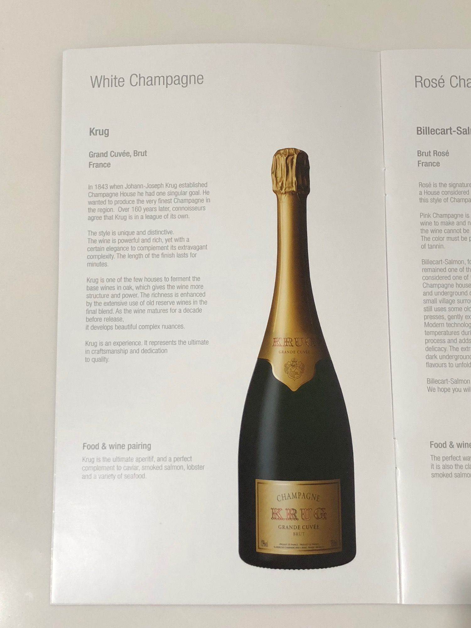 a menu with a bottle of champagne