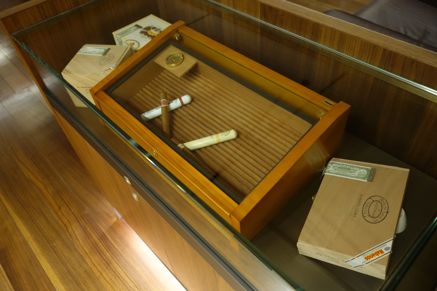 a cigars and cigars in a glass case
