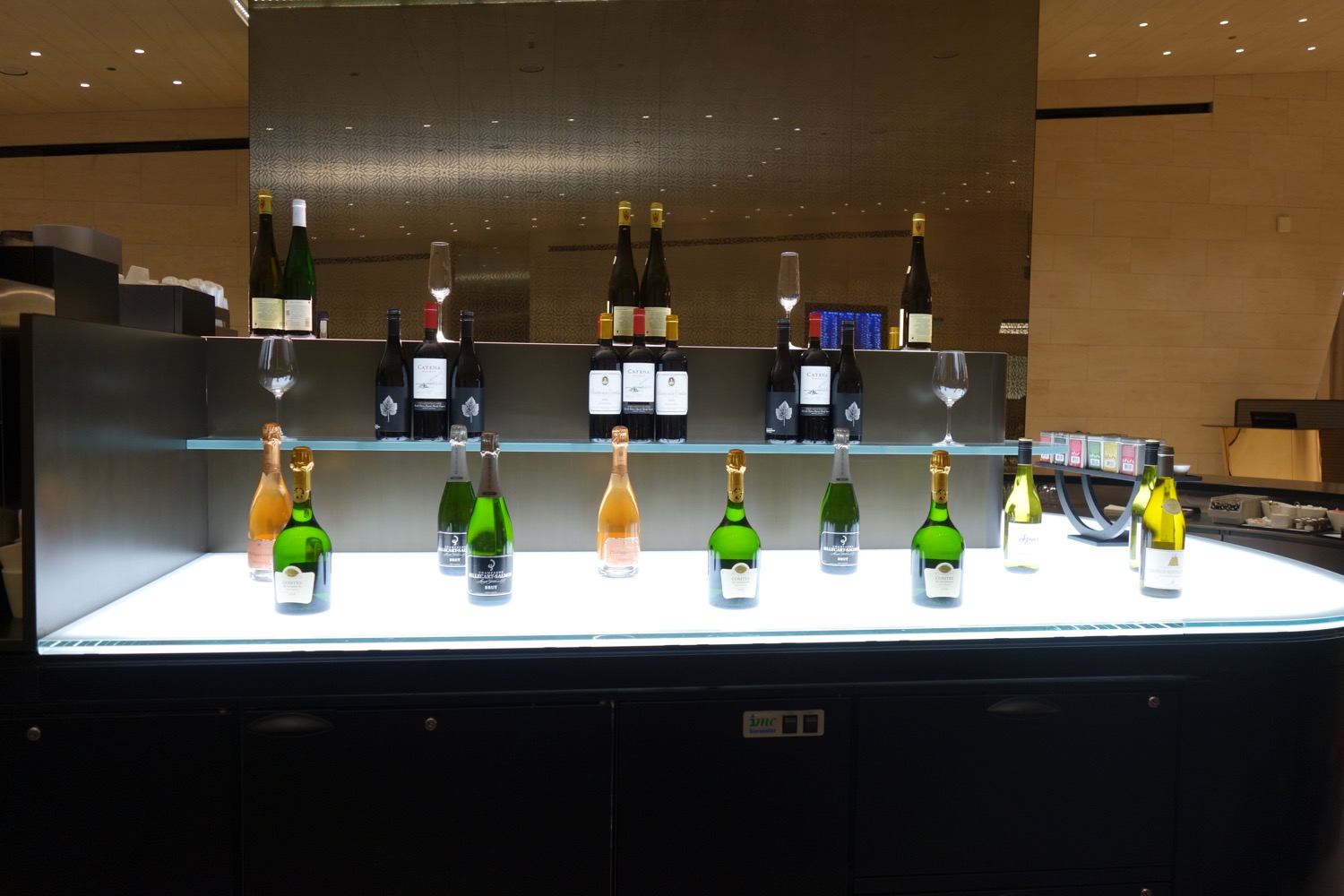 a group of bottles of wine on a counter