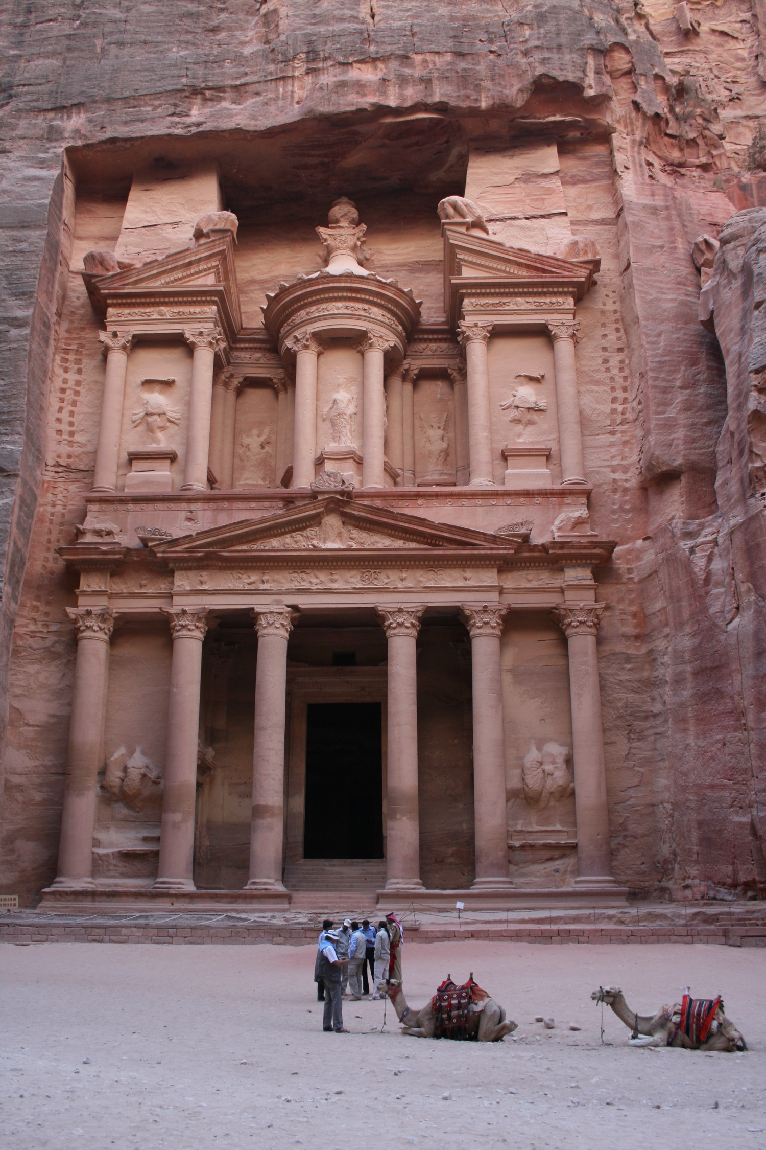 a group of people standing in front of Petra