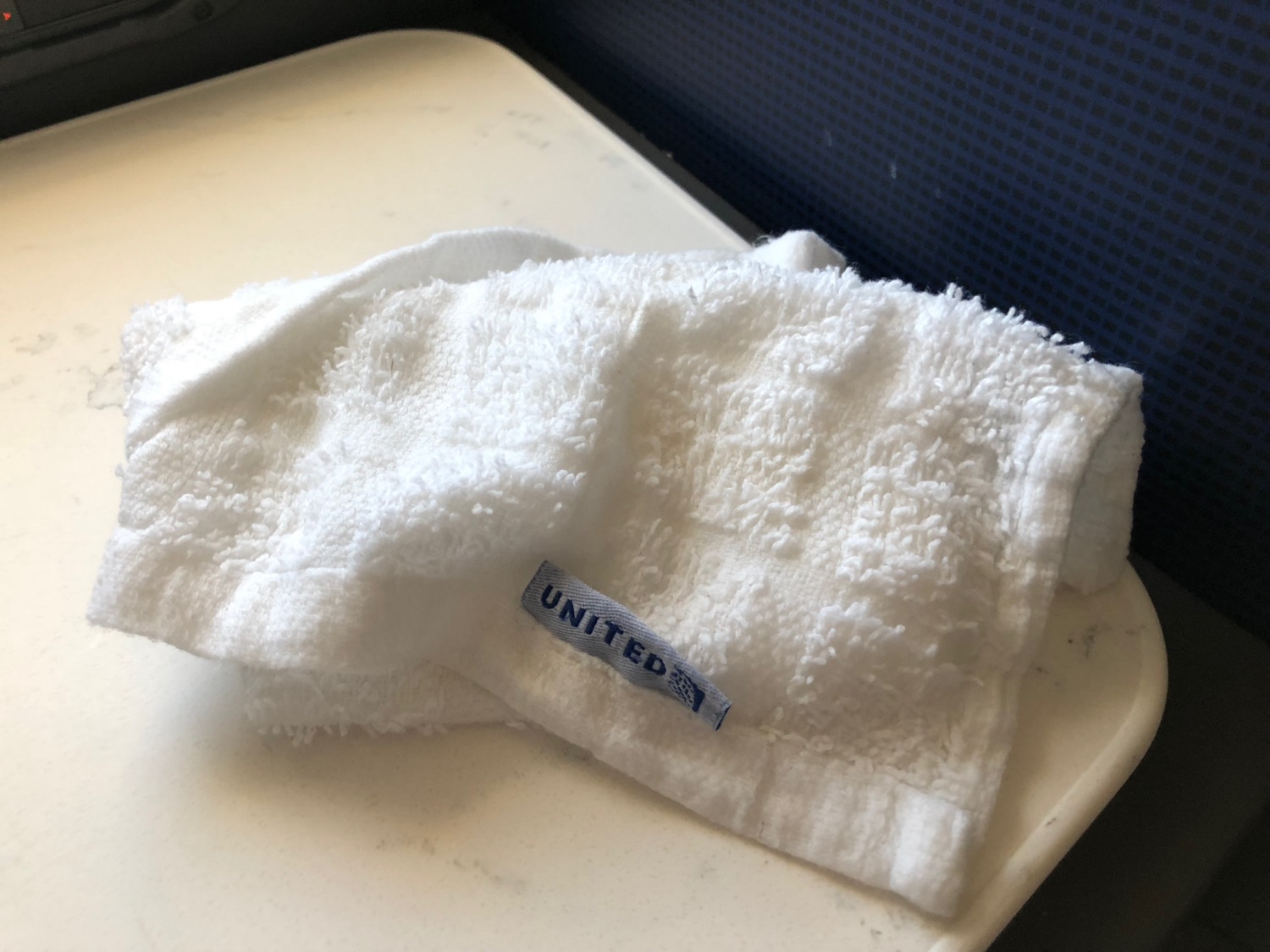 a white towel on a white surface