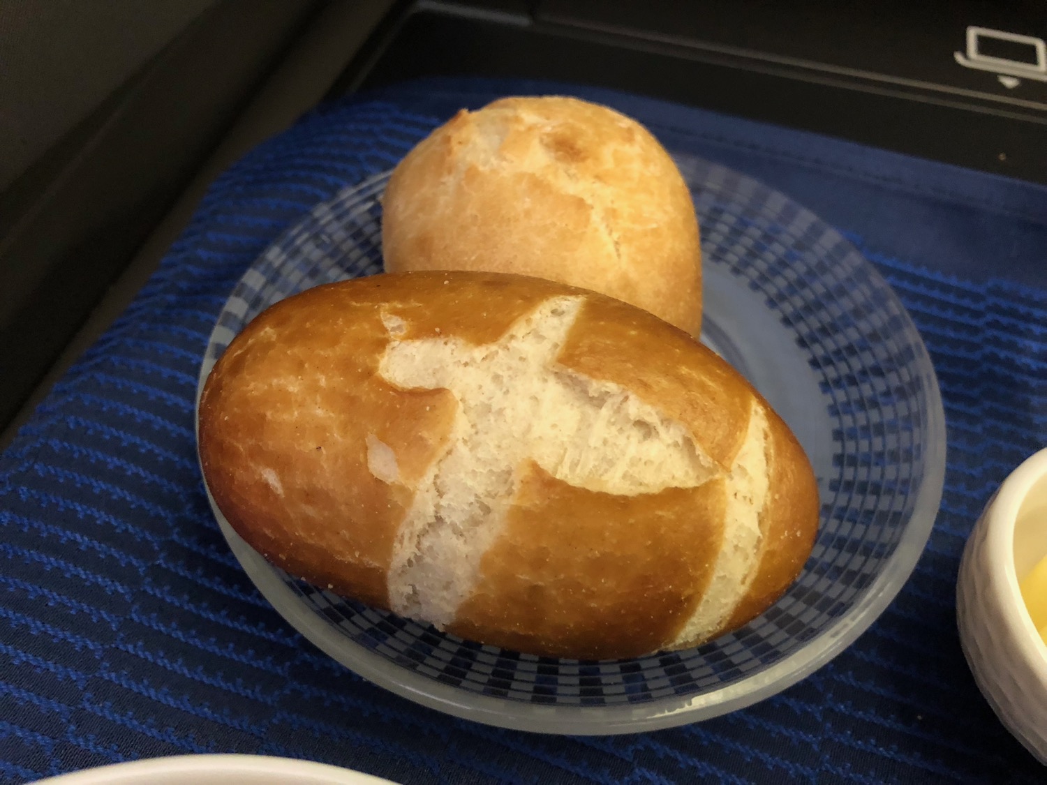 a plate of bread on a blue and white place mat