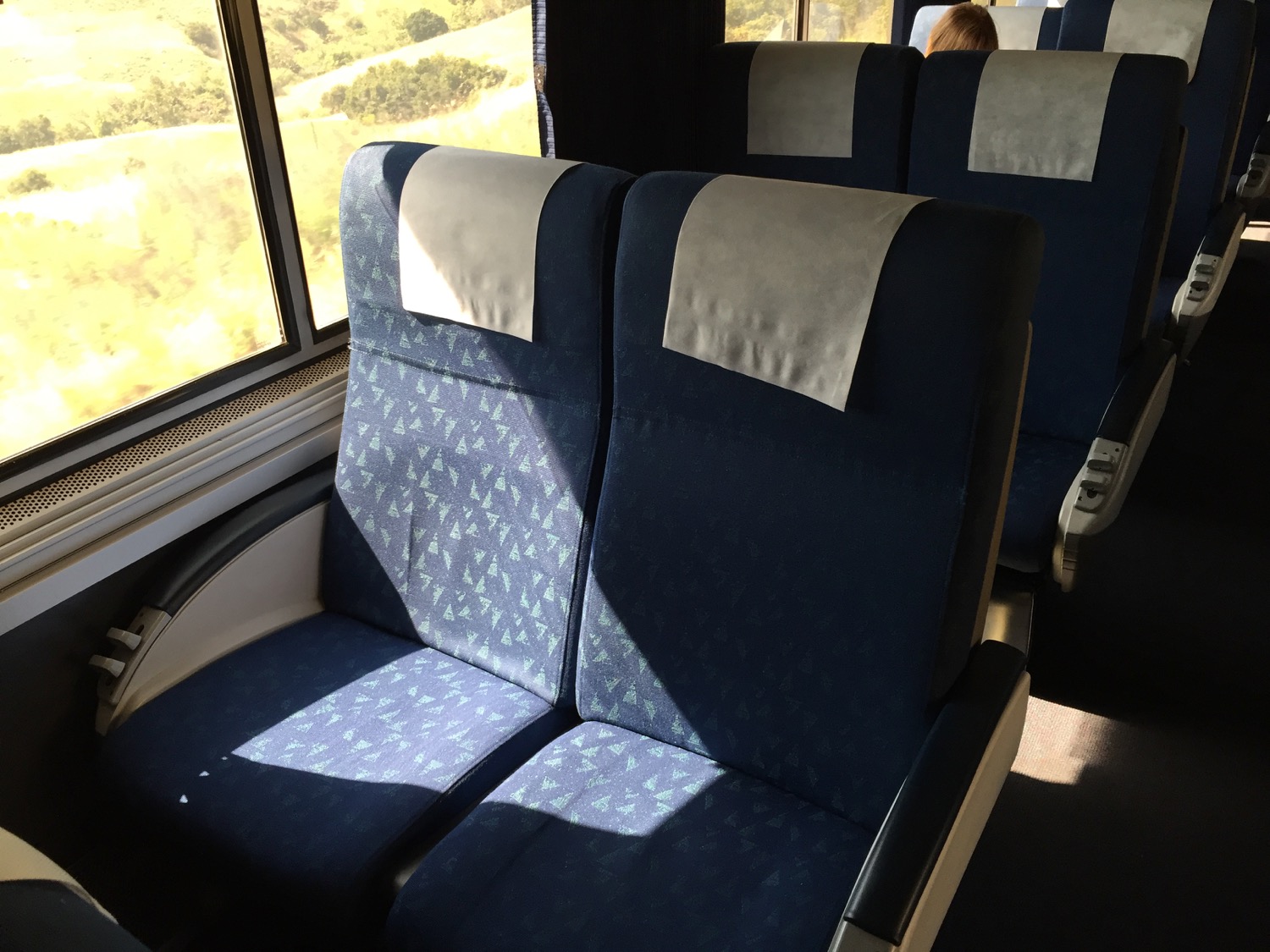 a blue seats on a train