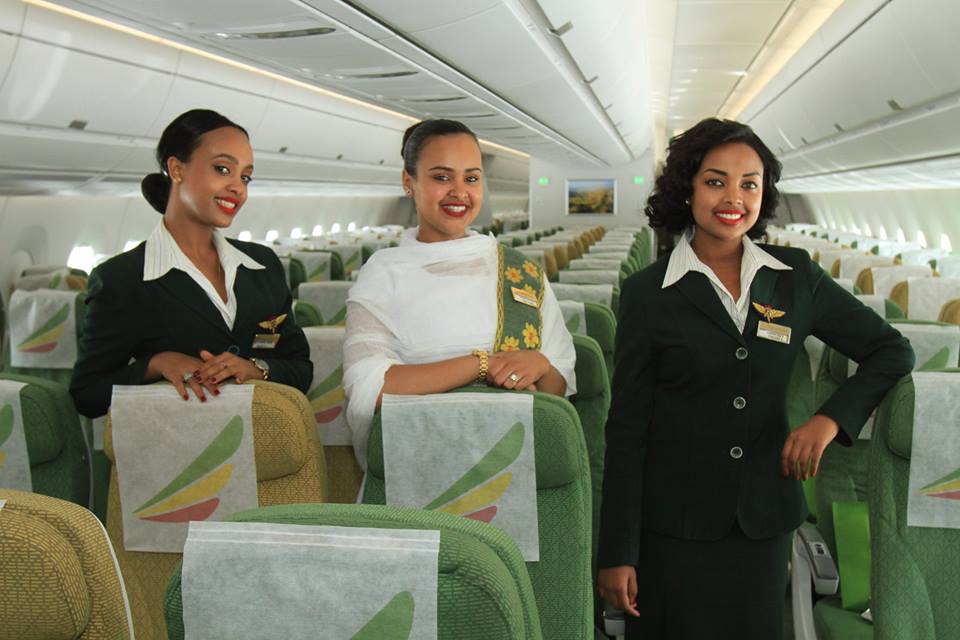 a group of women in flight uniforms