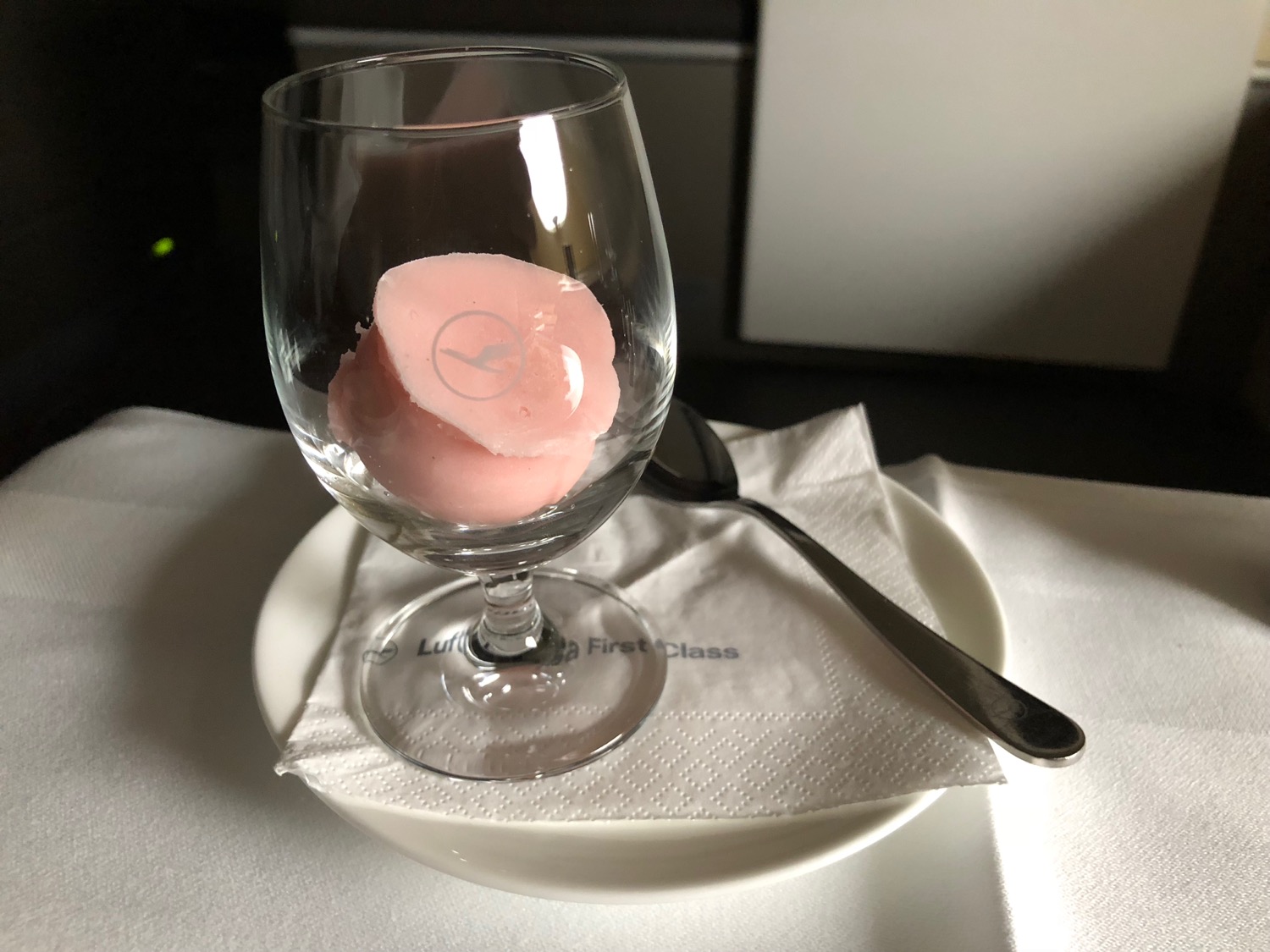 a glass with pink food inside