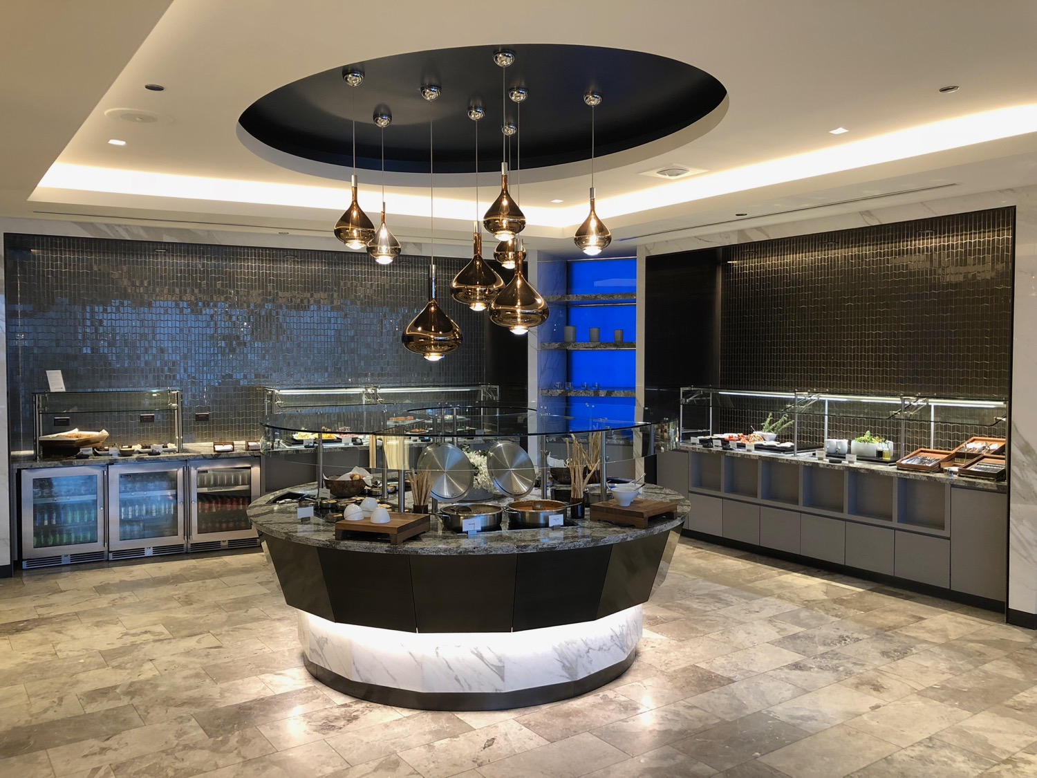 a restaurant with a circular counter with food items on it