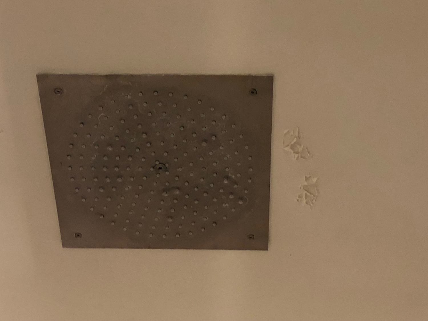 a metal square with holes in it