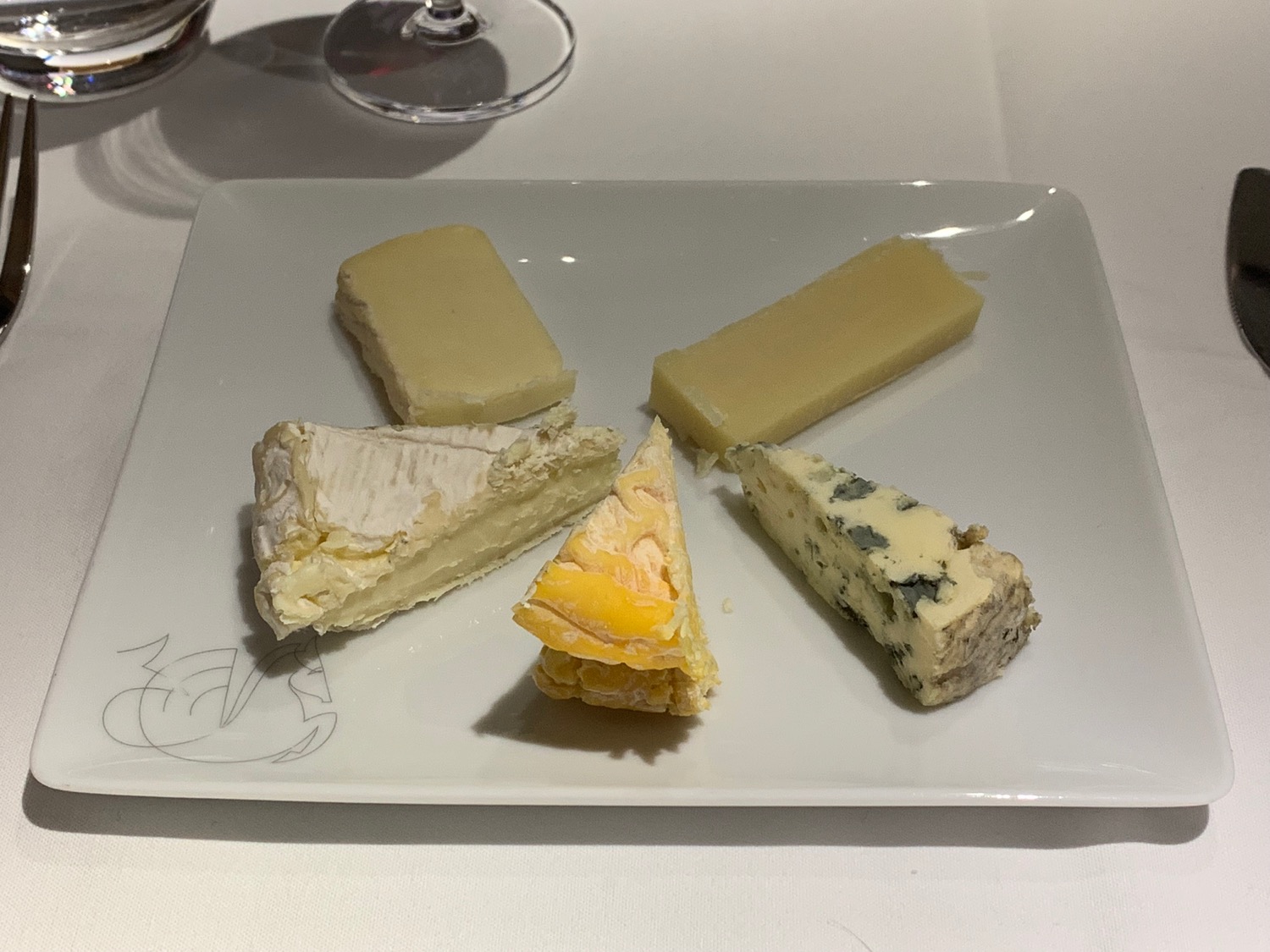 a plate of cheese on a table
