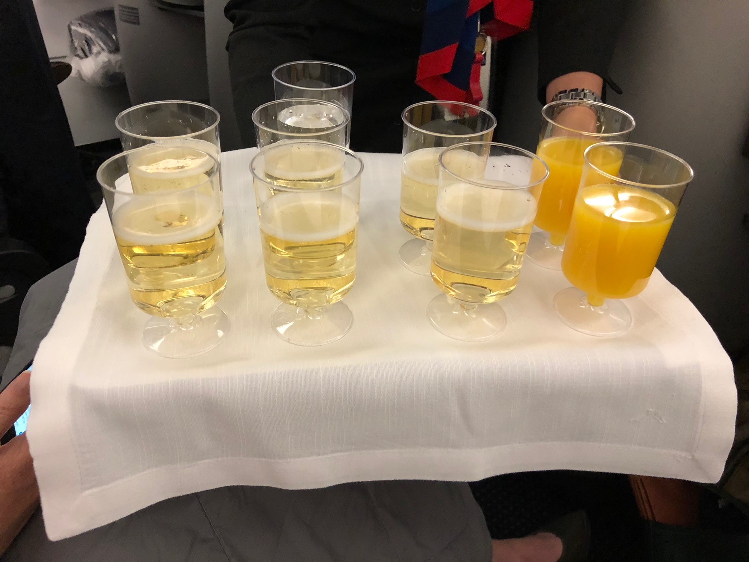 a group of glasses of liquid on a table