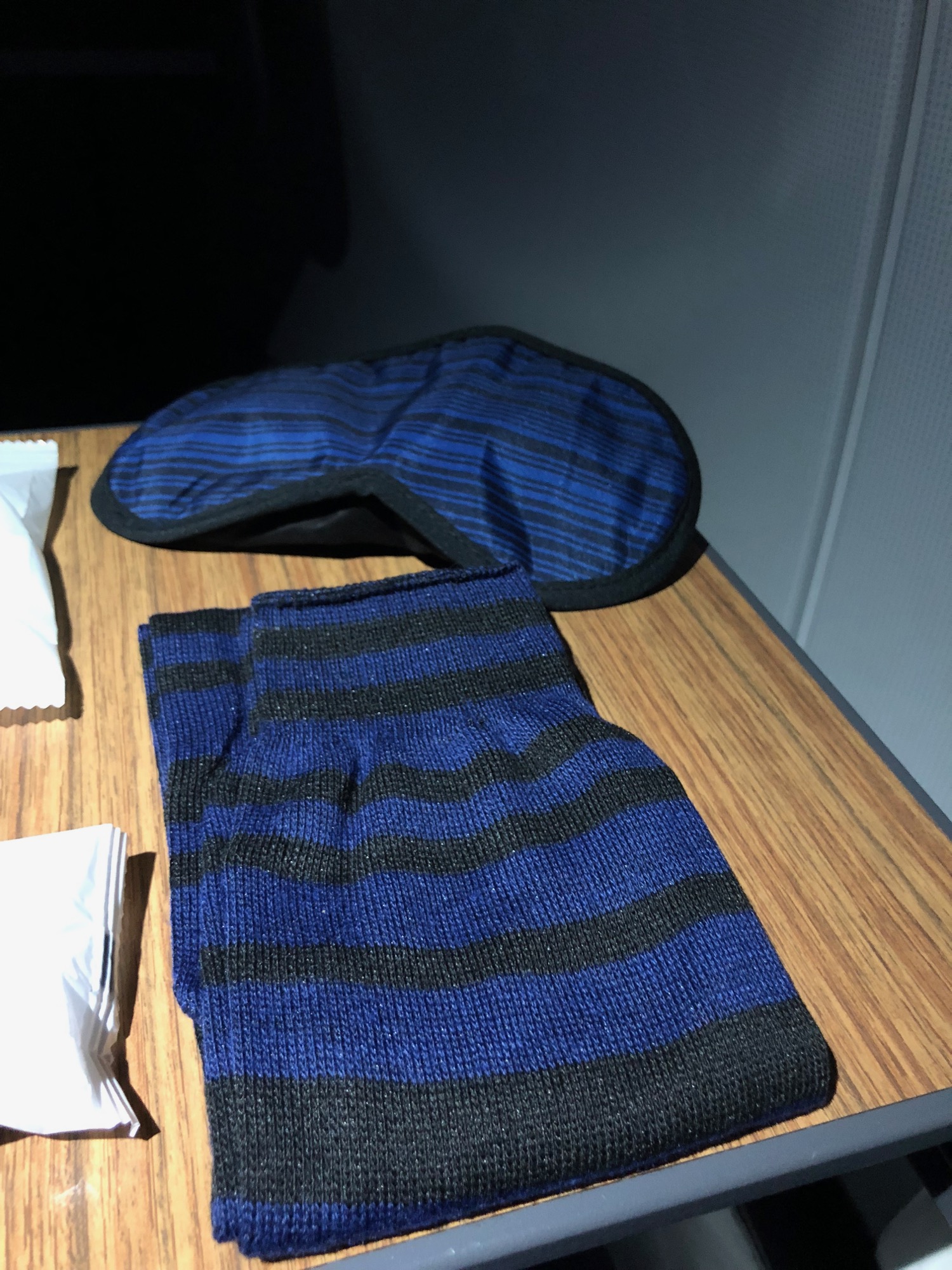 a pair of blue and black striped socks on a table