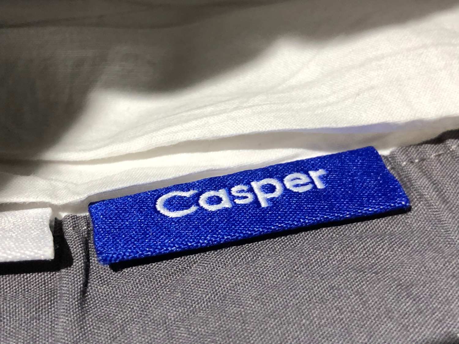 a blue label on a white shirt