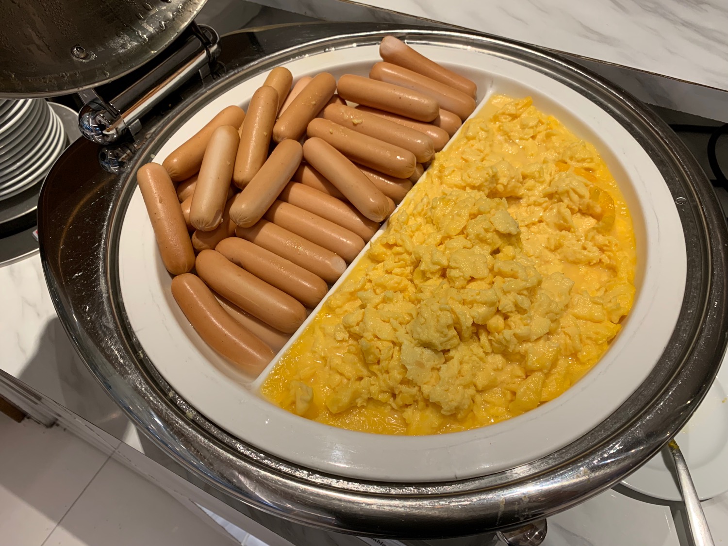 a plate of sausages and scrambled eggs