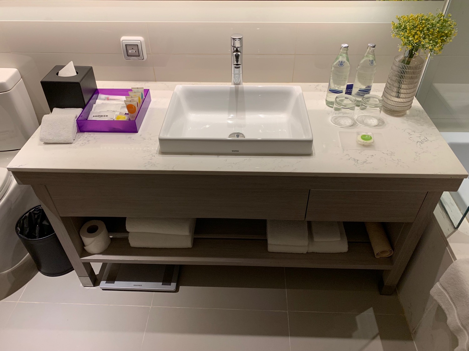a sink and bottles on a counter
