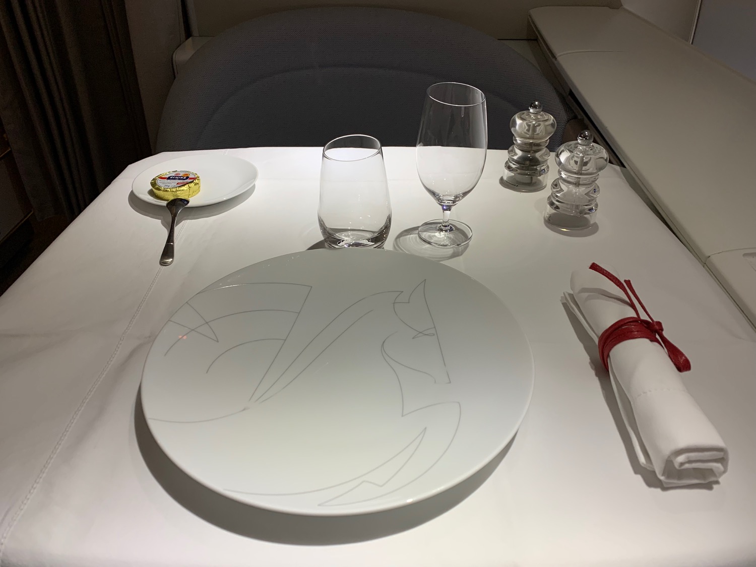 a plate and glasses on a table
