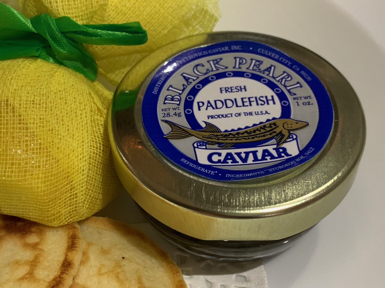 a jar of caviar and crackers