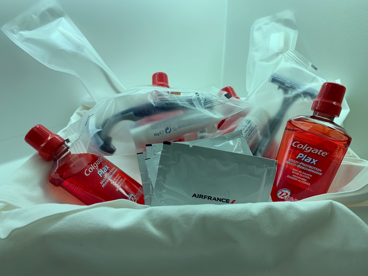 a bag of toothpaste and a tube of toothpaste