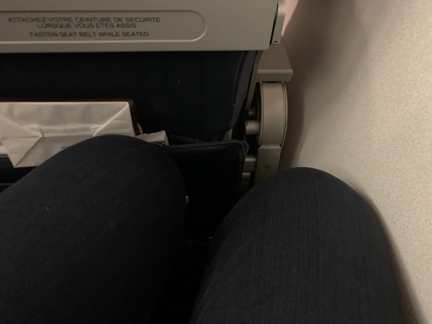 a person's legs and a seat