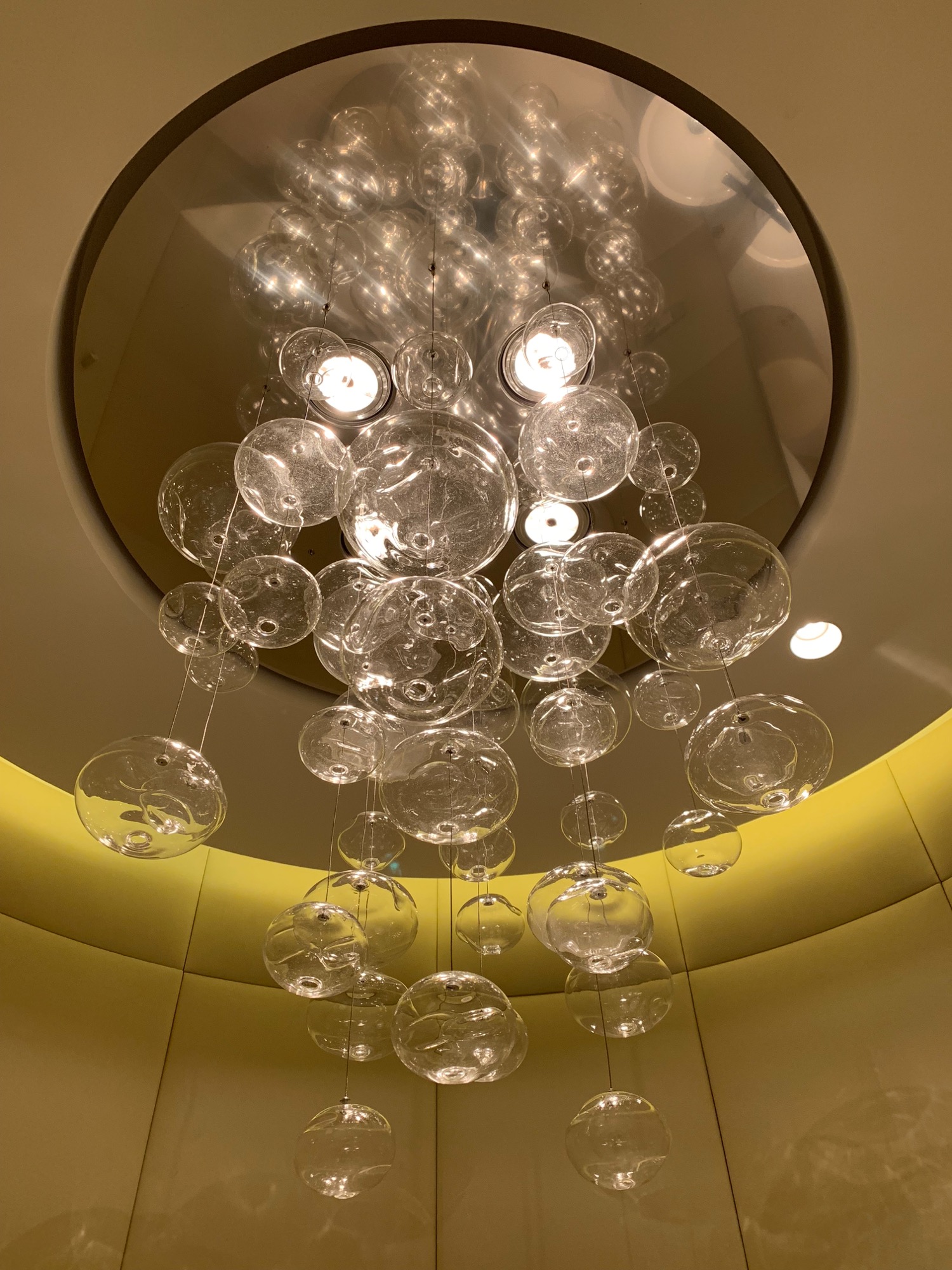 a chandelier with clear bubbles from the ceiling