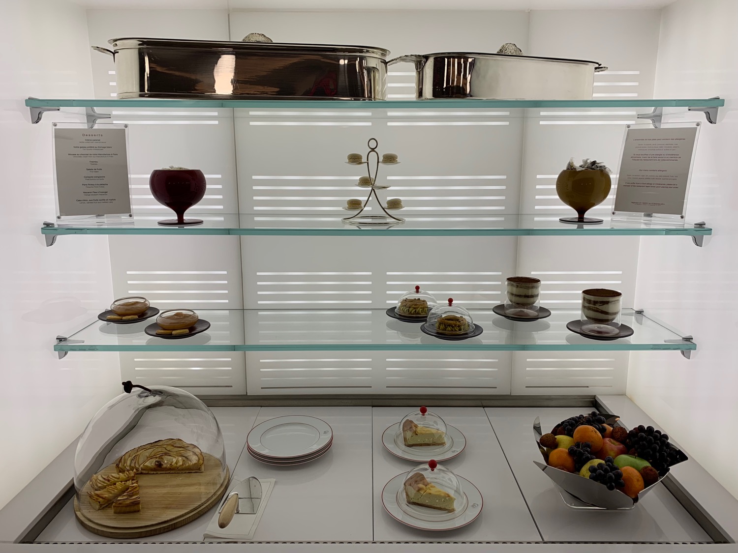 a glass shelves with food on it