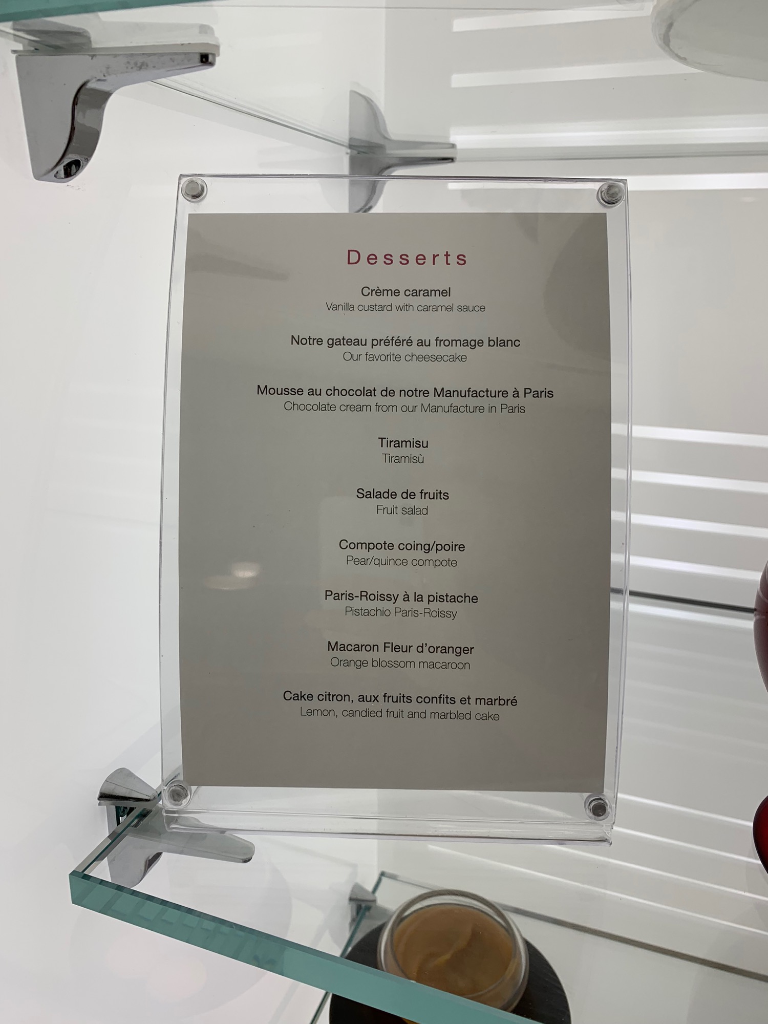 a menu on a glass shelf