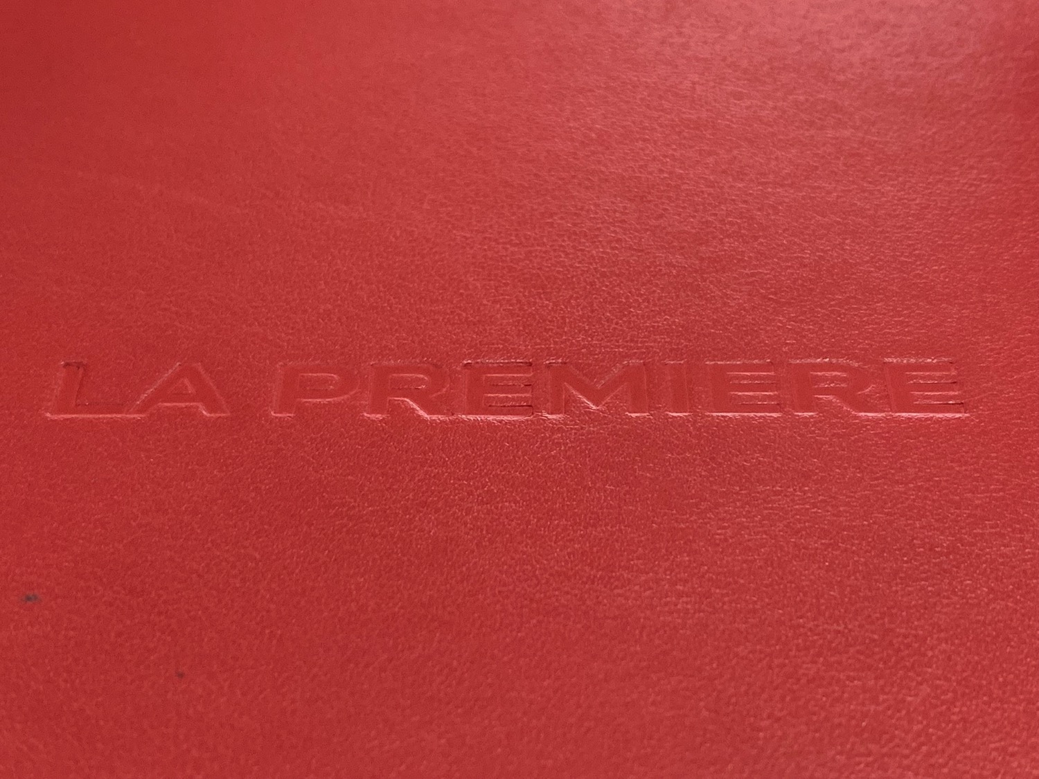 a red leather surface with text