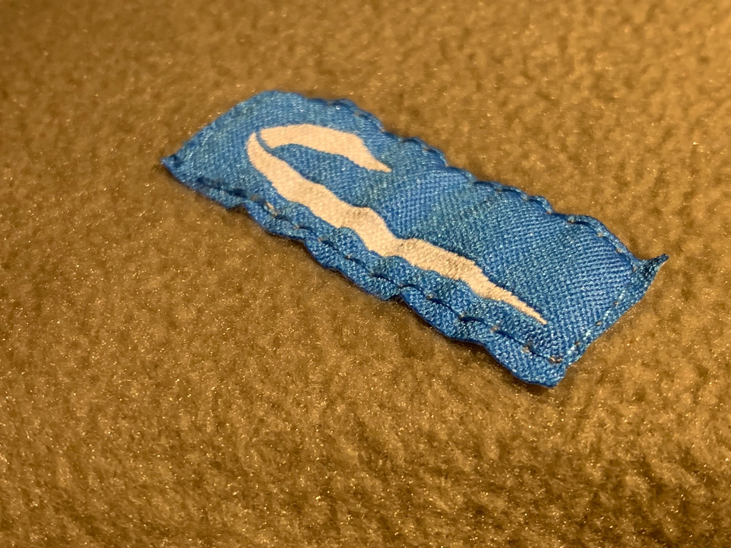 a blue and white fabric tag