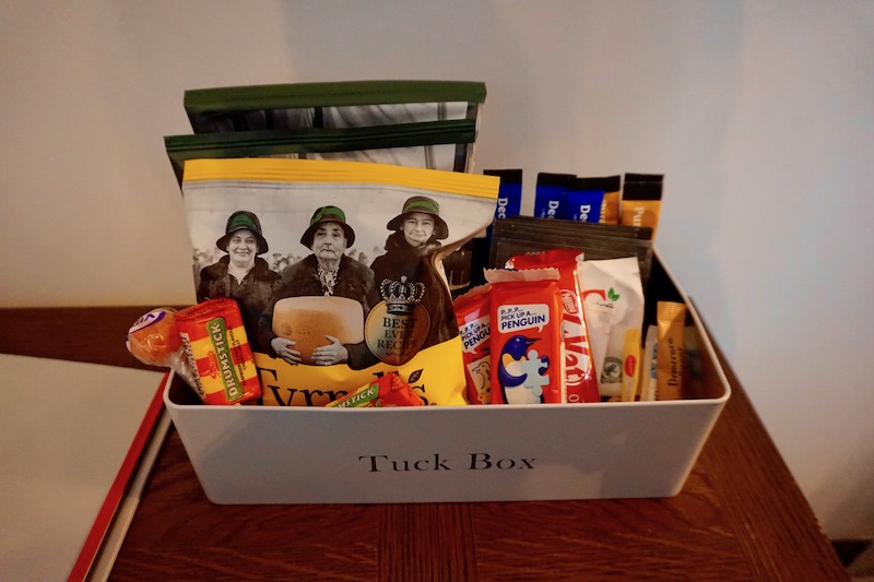 A "Tuck Box" full of snacks, teas and cocoa for all guests