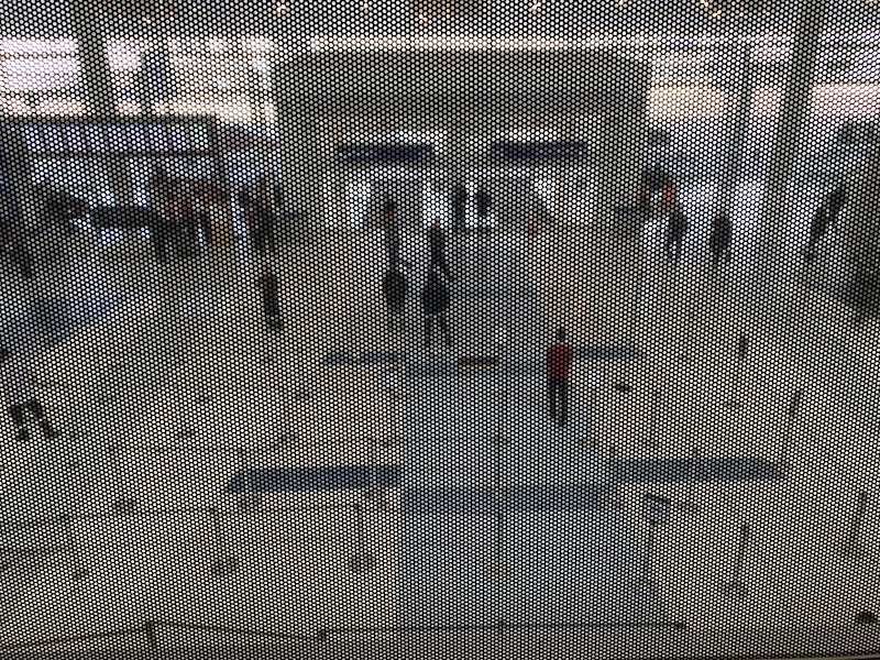 DFW Terminal D TSA line through the dot shaded window of the Centurion Lounge