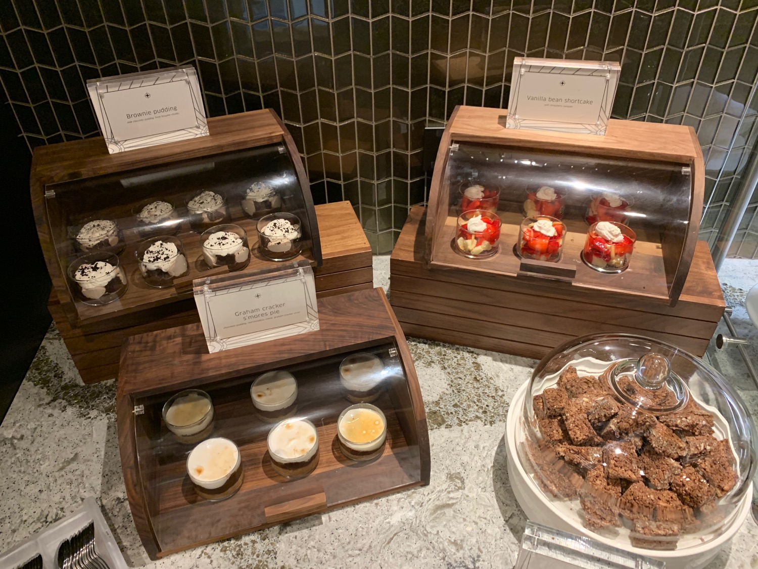 a group of desserts in a display case