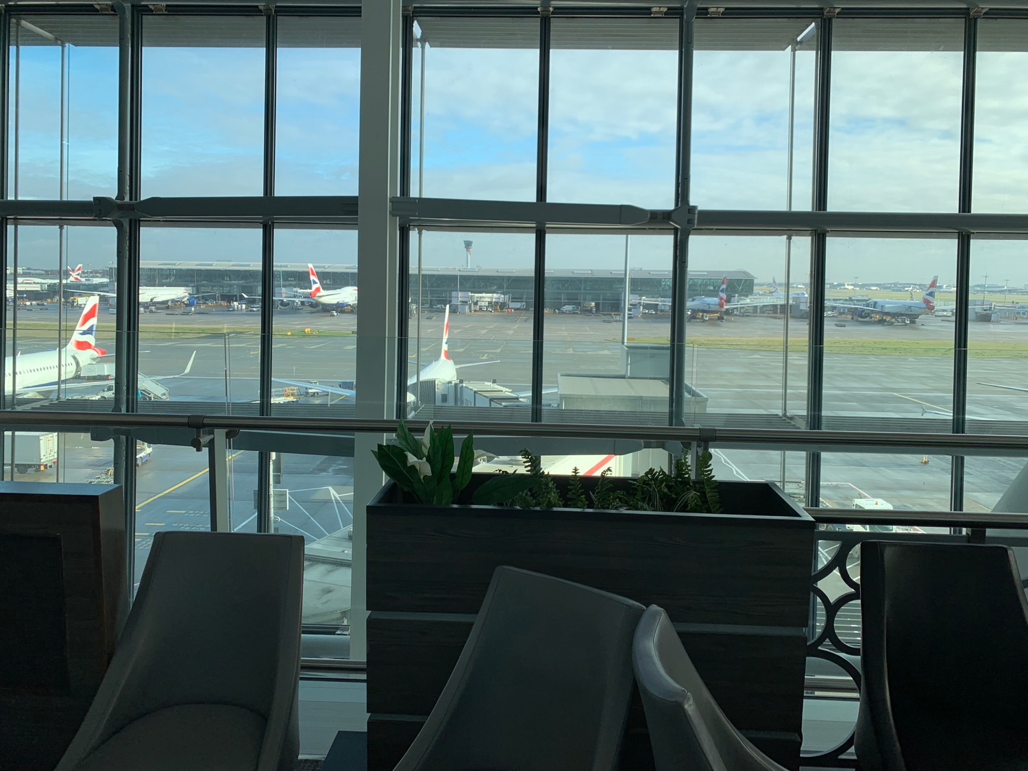 a window with planes in the background