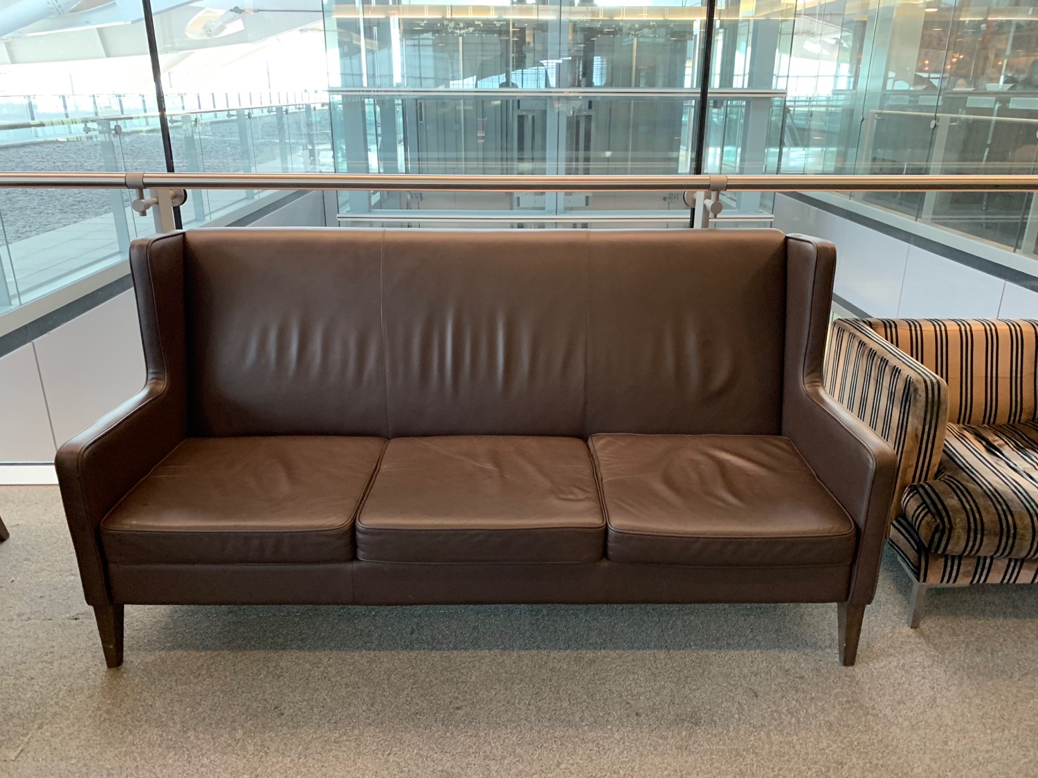 a brown leather couch in a room