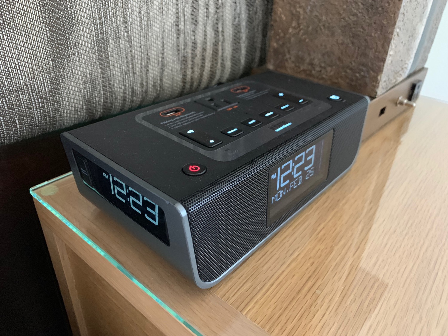 a black alarm clock on a table