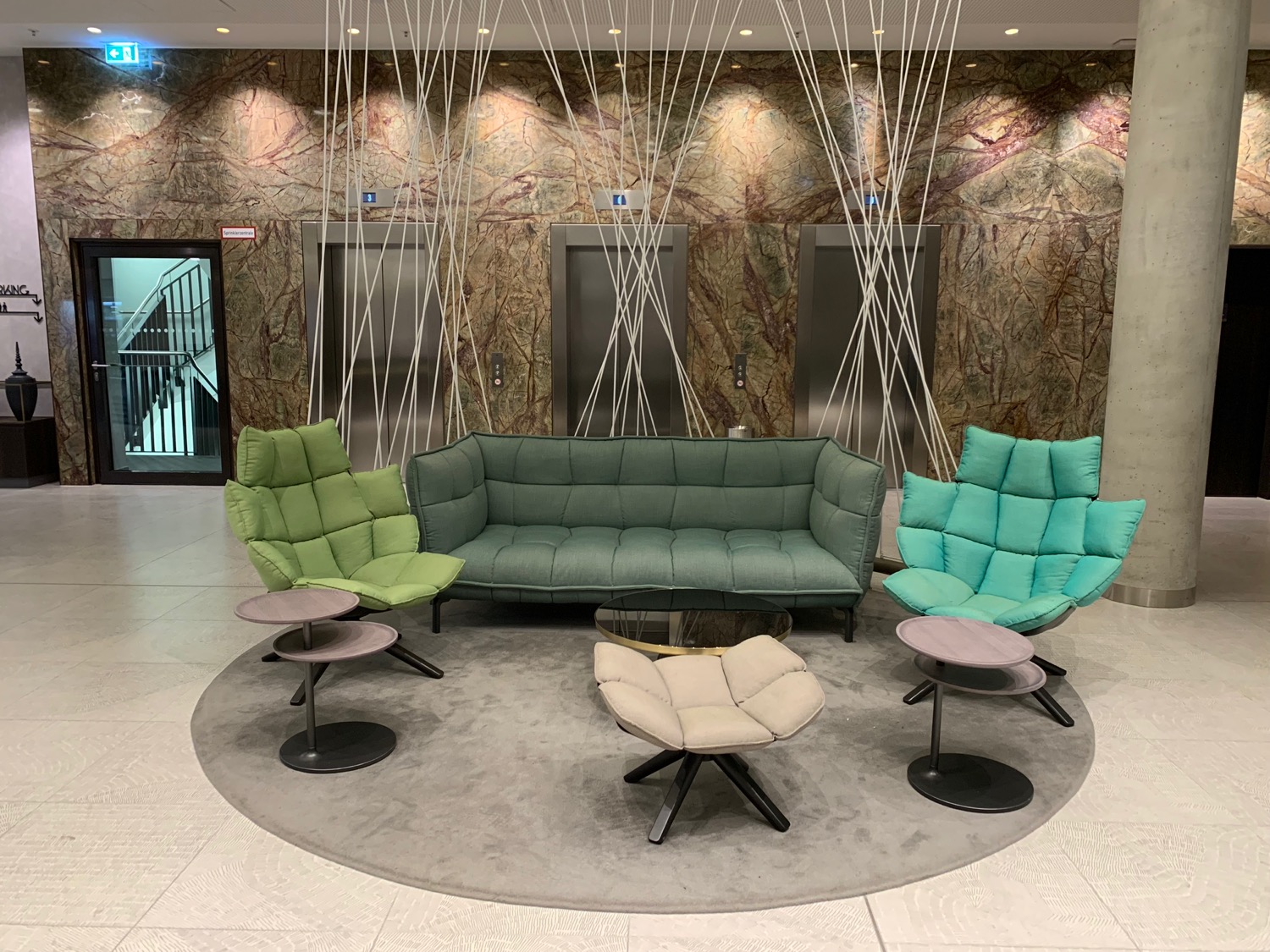 a group of chairs and a couch in a lobby