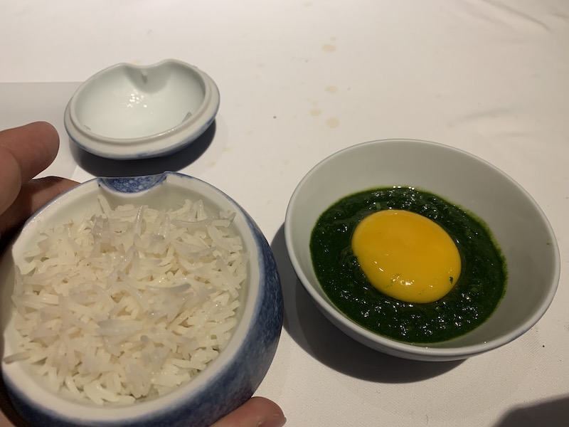 a bowl of rice and a egg in a bowl