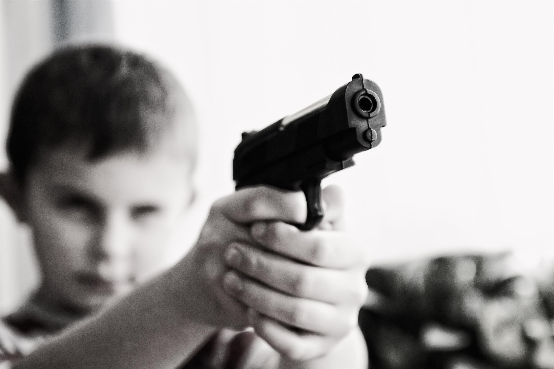 a child holding a gun