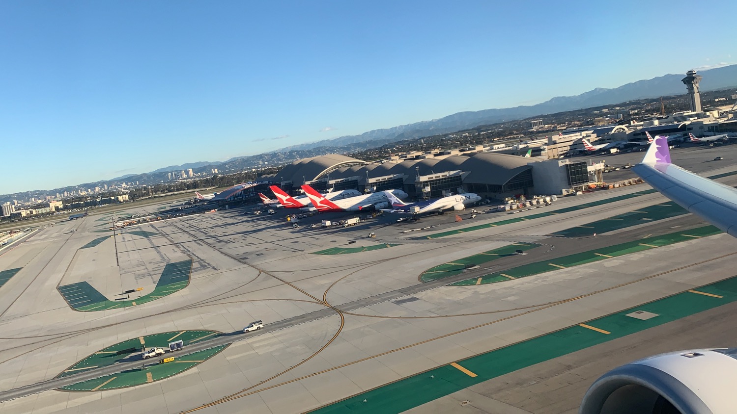 an airport with airplanes parked on the ground