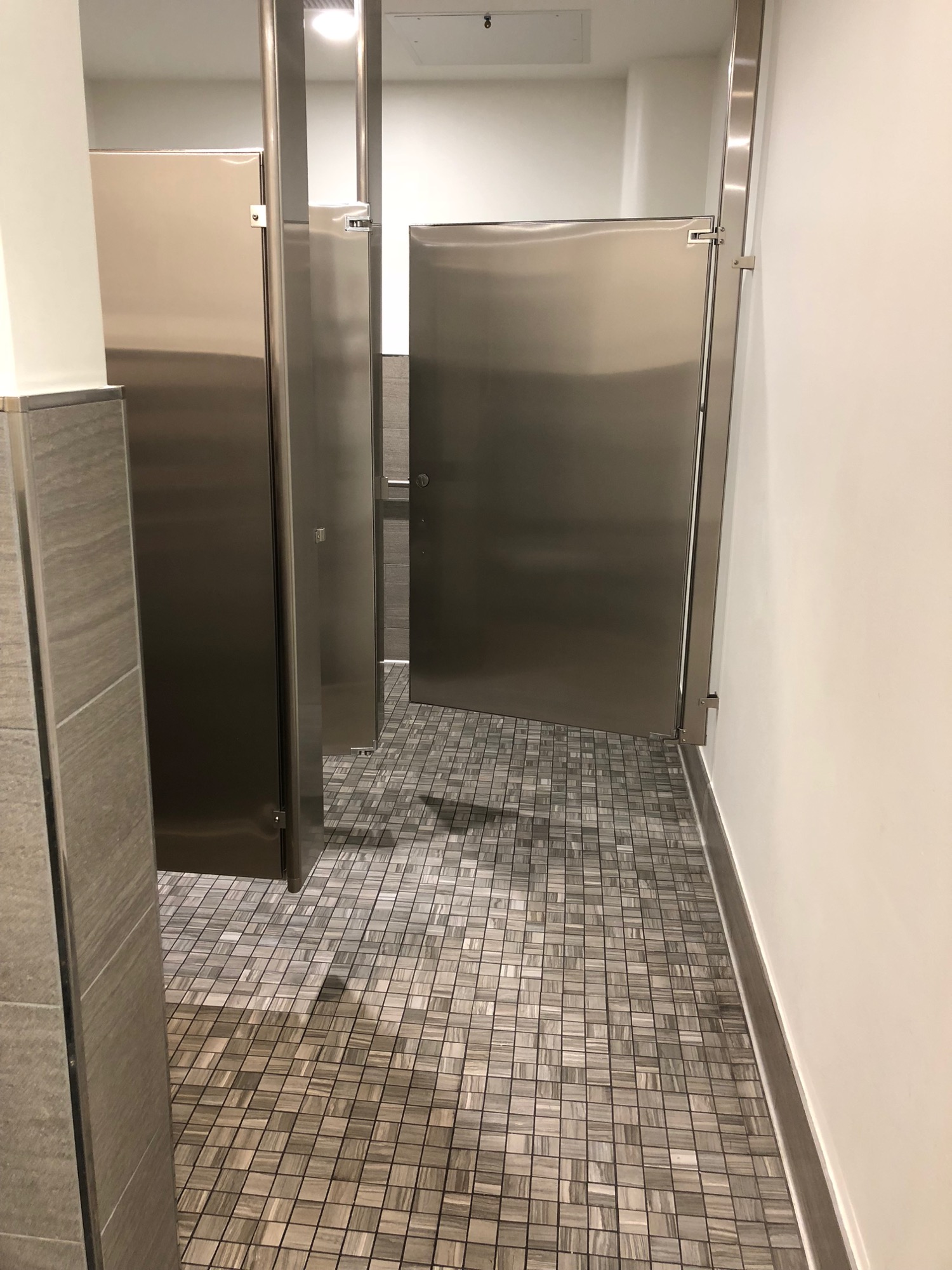 a bathroom with metal doors