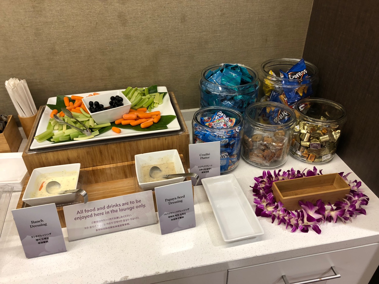 a buffet table with food and candy