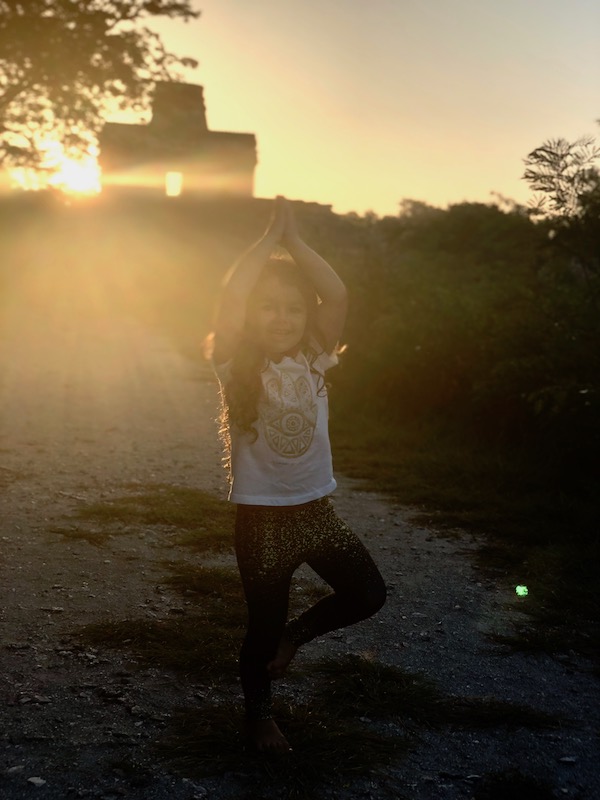 Lucy practicing her yoga just after the sun rose over the temple