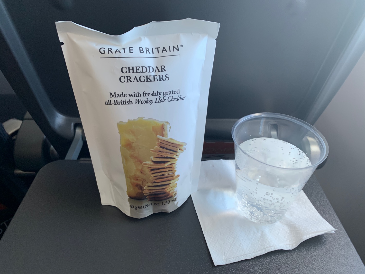 a bag of crackers and a glass of water