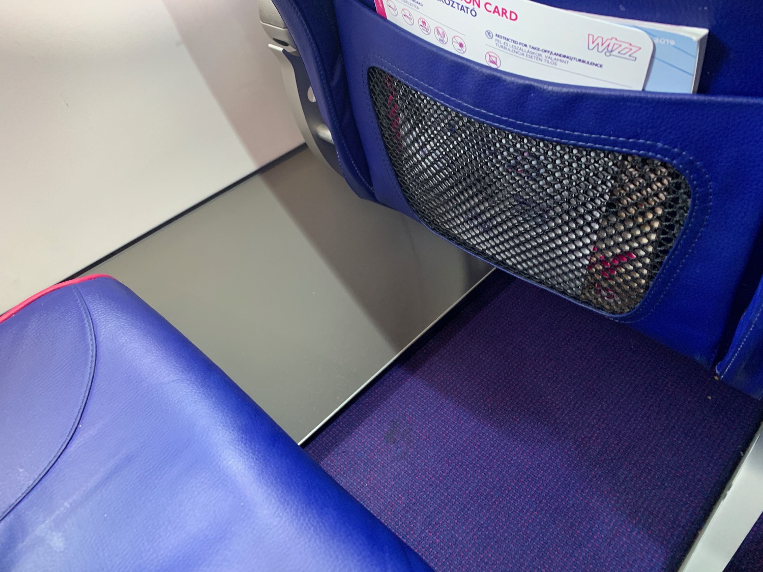 a blue seat with a mesh pocket