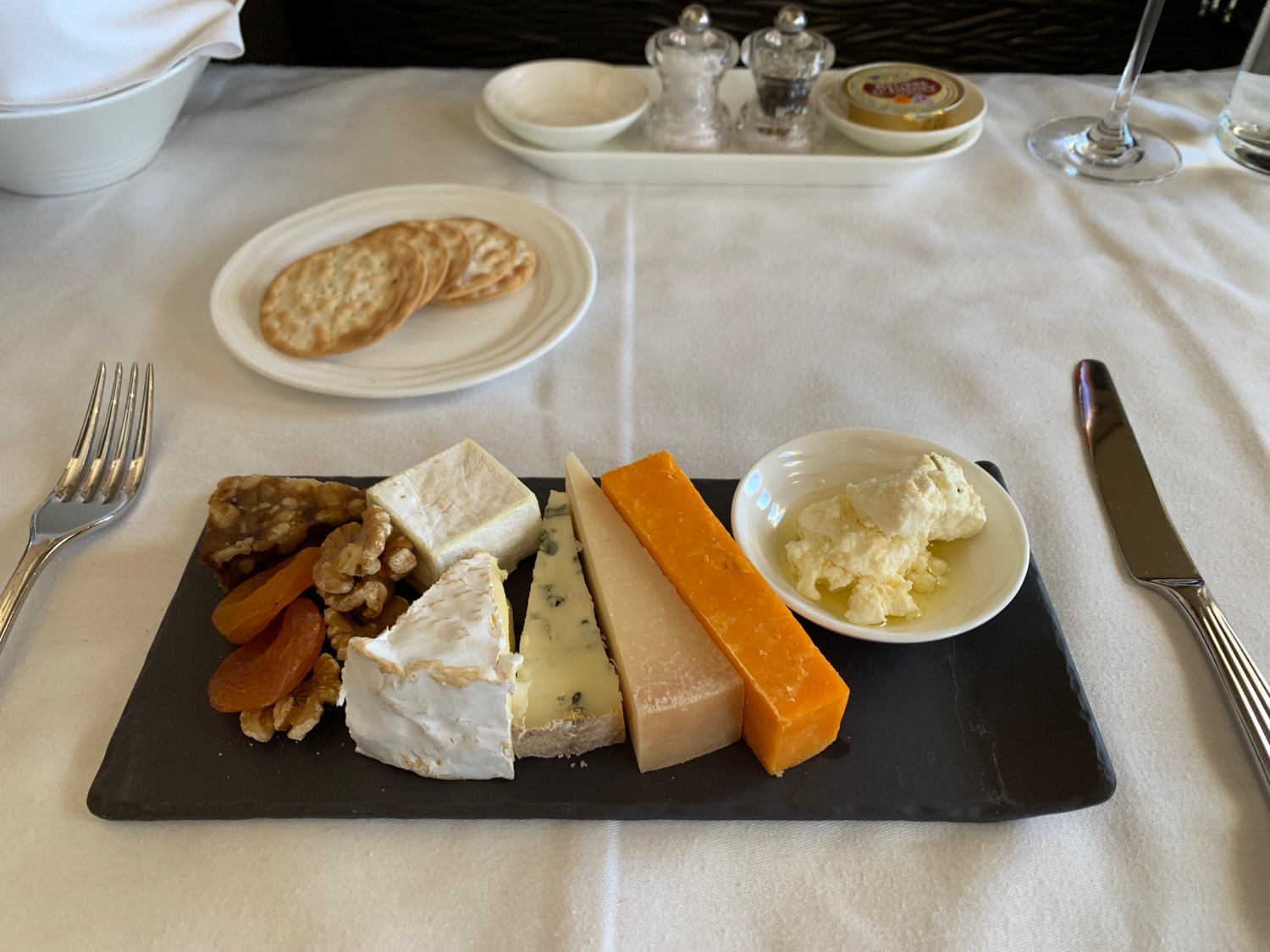 a plate of cheese and crackers on a table