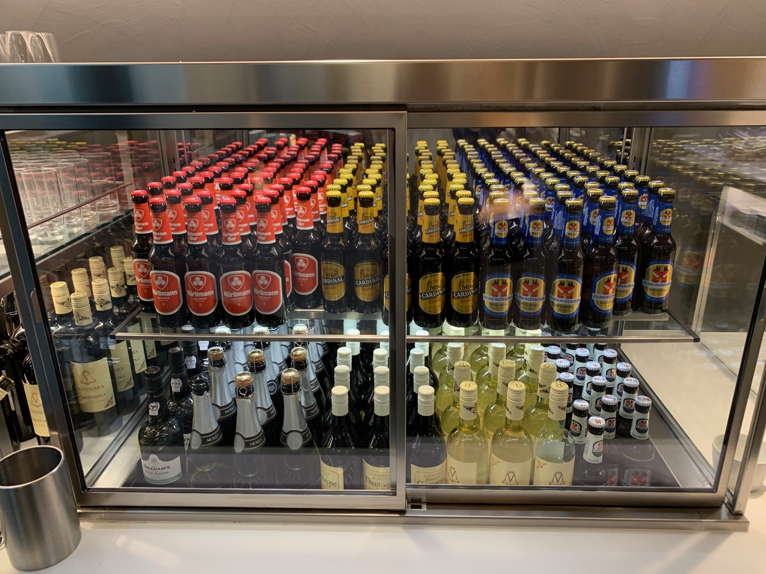 a display case with bottles of beer