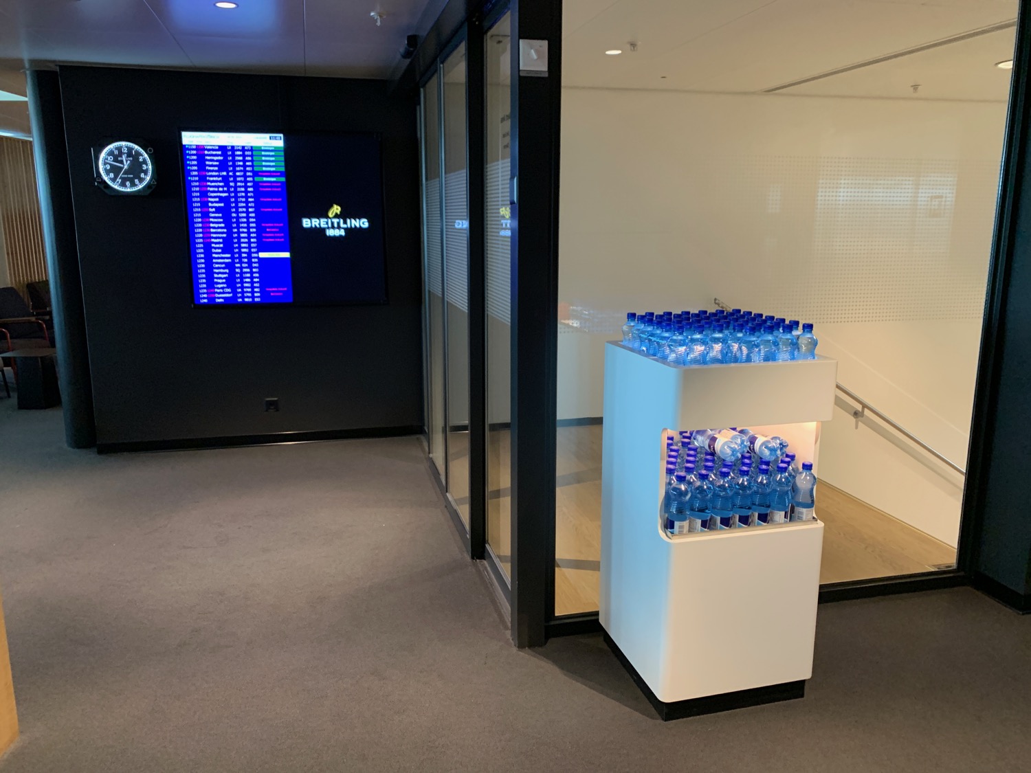 a room with a display of water bottles