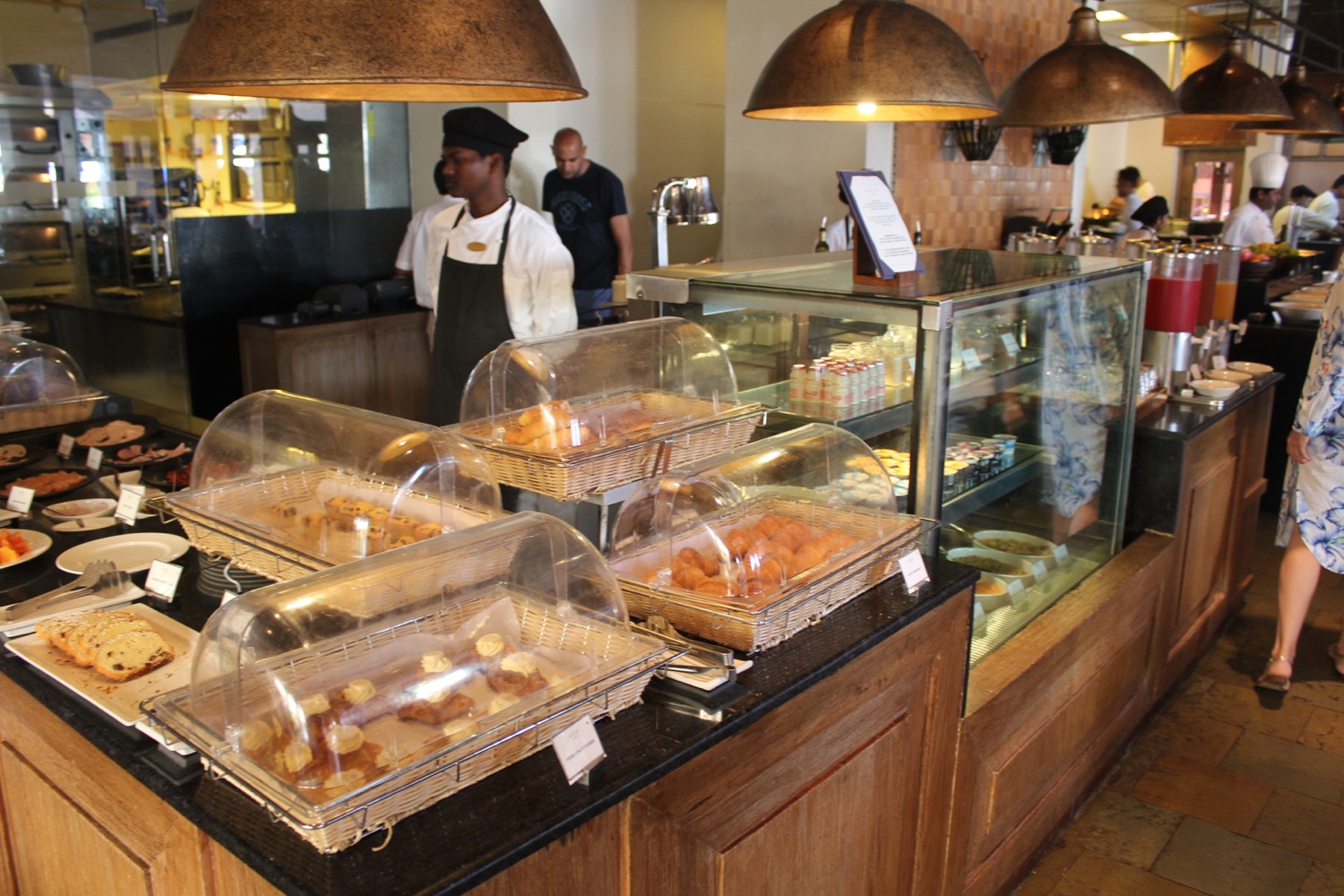 a counter with trays of pastries