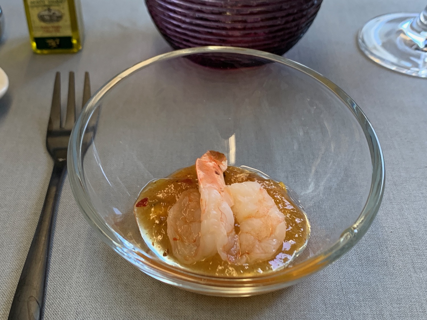 a bowl of shrimp in a sauce