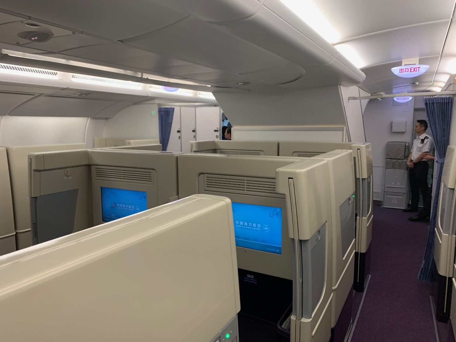 a row of white monitors on a plane